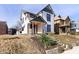 Charming renovated two-story home with inviting front porch and mature landscaping at 2110 N Talbott St, Indianapolis, IN 46202
