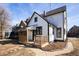 A two-story home is showcased, featuring a welcoming covered porch and tidy landscaping at 2110 N Talbott St, Indianapolis, IN 46202