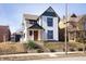 Charming renovated two-story home with inviting front porch and mature landscaping at 2110 N Talbott St, Indianapolis, IN 46202