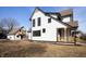 Charming two-story home featuring a covered porch and a detached garage at 2110 N Talbott St, Indianapolis, IN 46202