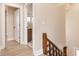 Second floor hallway featuring hardwood floors and doorway to bathroom at 2110 N Talbott St, Indianapolis, IN 46202