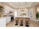 Bright, modern kitchen with stainless steel appliances, island seating, and stylish backsplash at 2110 N Talbott St, Indianapolis, IN 46202