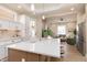 Open-concept kitchen with island seating, stainless steel appliances, and seamless living space integration at 2110 N Talbott St, Indianapolis, IN 46202