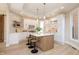 Charming kitchen with an island, quartz countertops, modern appliances, and decorative backsplash details at 2110 N Talbott St, Indianapolis, IN 46202