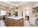 Bright, modern kitchen with a center island, dining area views, and open access to the living room at 2110 N Talbott St, Indianapolis, IN 46202