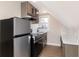 Kitchen features stainless steel appliances, a white marble backsplash, and light-colored cabinets at 2110 N Talbott St, Indianapolis, IN 46202