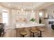 Bright kitchen features white cabinets, a large island with seating, quartz countertops, and gold hardware accents at 2110 N Talbott St, Indianapolis, IN 46202