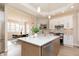 Open-concept kitchen with an island, stainless steel appliances, and seamless transition to the dining area at 2110 N Talbott St, Indianapolis, IN 46202