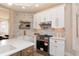 Well-appointed kitchen featuring a stainless steel range, quartz countertops, and stylish backsplash at 2110 N Talbott St, Indianapolis, IN 46202