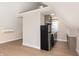 Modern kitchen with stainless steel appliances, light-colored cabinets, and hardwood floors at 2110 N Talbott St, Indianapolis, IN 46202