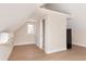 Living room with hardwood floors, a mini kitchen, and a window with natural light at 2110 N Talbott St, Indianapolis, IN 46202