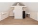 A spacious living room features hardwood floors and a mini kitchen with modern appliances at 2110 N Talbott St, Indianapolis, IN 46202