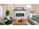 Bright living room featuring a stone fireplace, neutral decor, and inviting seating arrangement at 2110 N Talbott St, Indianapolis, IN 46202