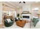 Open living space with a fireplace, modern furnishings, and seamless transition to the kitchen area at 2110 N Talbott St, Indianapolis, IN 46202