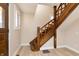 Elegant wooden staircase with decorative carvings and natural light at 2110 N Talbott St, Indianapolis, IN 46202