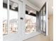 Close-up view of a multi-paned window with white trim, offering a glimpse of the neighborhood outside at 2110 N Talbott St, Indianapolis, IN 46202