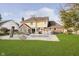 Spacious backyard featuring a pool with slide, lush green grass, and a charming two-story home at 21360 Oakview Dr, Noblesville, IN 46062