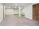 Large basement with neutral walls, carpet flooring, and closet doors, offering versatile potential at 21360 Oakview Dr, Noblesville, IN 46062