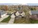 An aerial view of a suburban two-story home featuring a yellow exterior and a well-kept lawn at 21360 Oakview Dr, Noblesville, IN 46062