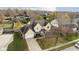 An aerial view of a suburban two-story home featuring a yellow exterior and mature trees at 21360 Oakview Dr, Noblesville, IN 46062