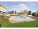 Backyard pool with concrete surround, slide, and a view of the home's exterior at 21360 Oakview Dr, Noblesville, IN 46062