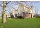 Charming home featuring a manicured front yard, and a yellow and brick facade at 21360 Oakview Dr, Noblesville, IN 46062
