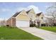Home showcasing a well-manicured front lawn and long driveway at 21360 Oakview Dr, Noblesville, IN 46062
