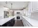 Updated kitchen showcasing white cabinets, stainless steel appliances, subway tile backsplash, and a sleek island at 21360 Oakview Dr, Noblesville, IN 46062