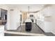 Bright kitchen featuring white cabinetry, stainless steel appliances, and a stylish black island at 21360 Oakview Dr, Noblesville, IN 46062