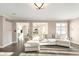 Comfortable living room featuring a large sectional sofa and view to the kitchen and dining area at 21360 Oakview Dr, Noblesville, IN 46062