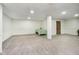 Spacious basement with carpet flooring, a support beam, and neutral walls, ready for customization at 21360 Oakview Dr, Noblesville, IN 46062