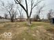 Large backyard with a mature tree at 3039 N Campbell Ave, Indianapolis, IN 46218