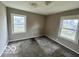 Small bedroom featuring carpeted flooring and two windows at 3039 N Campbell Ave, Indianapolis, IN 46218