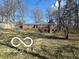 Large backyard with mature trees behind a brick home at 3233 E 48Th St, Indianapolis, IN 46205