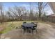 Backyard patio area with an outdoor dining set at 3233 E 48Th St, Indianapolis, IN 46205