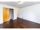 Bedroom with hardwood floors and closet with sliding doors at 3233 E 48Th St, Indianapolis, IN 46205