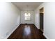 Cozy dining room with beautiful hardwood floors and a charming light fixture at 3233 E 48Th St, Indianapolis, IN 46205