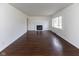Inviting living room boasts a cozy fireplace, hardwood floors, and a bright, airy atmosphere at 3233 E 48Th St, Indianapolis, IN 46205