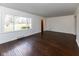Sunlit living room with hardwood floors and large window that fills the space with natural light at 3233 E 48Th St, Indianapolis, IN 46205