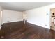 Spacious living area with gleaming hardwood floors, offering a versatile layout for entertaining at 3233 E 48Th St, Indianapolis, IN 46205