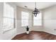 Charming dining area features a modern light fixture and ample natural light from multiple windows at 3841 Constitution Dr, Carmel, IN 46032