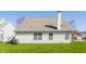 The exterior features vinyl siding, a large roof with skylights, and a well-maintained lawn at 3841 Constitution Dr, Carmel, IN 46032