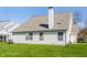 The exterior features vinyl siding, a large roof with skylights, and a well-maintained lawn at 3841 Constitution Dr, Carmel, IN 46032