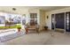 Relaxing front porch with bench, rug, and hanging swing, perfect for enjoying the outdoors at 3841 Constitution Dr, Carmel, IN 46032