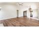 Spacious living room with vaulted ceiling, wood floors, chandelier, and a bright entryway at 3841 Constitution Dr, Carmel, IN 46032