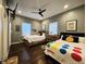 Cozy bedroom featuring two beds, hardwood floors, modern decor, and ample natural light at 422 Johnson Ave, Franklin, IN 46131