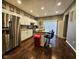 Well-lit kitchen with a large island, stainless steel appliances, and dark wood flooring at 422 Johnson Ave, Franklin, IN 46131