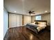 Serene main bedroom featuring hardwood floors, a ceiling fan, and spacious closet at 422 Johnson Ave, Franklin, IN 46131