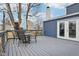 Outdoor deck with a table, chairs, and a view of the backyard and house at 455 Meadowview Ln, Greenwood, IN 46142
