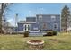 A spacious backyard has a deck, a fire pit, and a well-maintained lawn at 455 Meadowview Ln, Greenwood, IN 46142